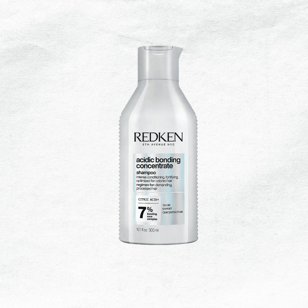 Redken Acidic Bonding Concentrate Shampoo bottle on a white background.