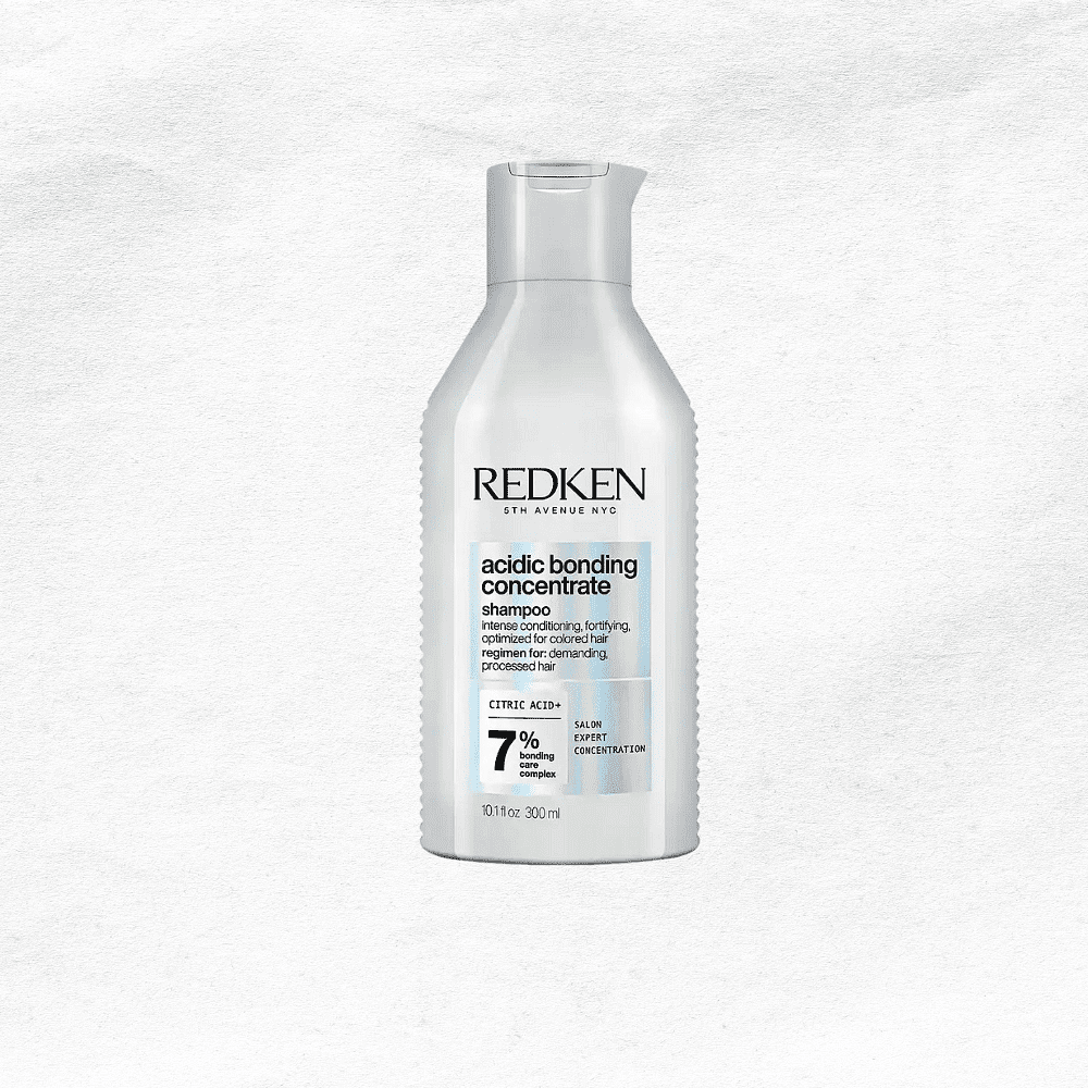 Redken Acidic Bonding Concentrate Shampoo bottle on a white background.